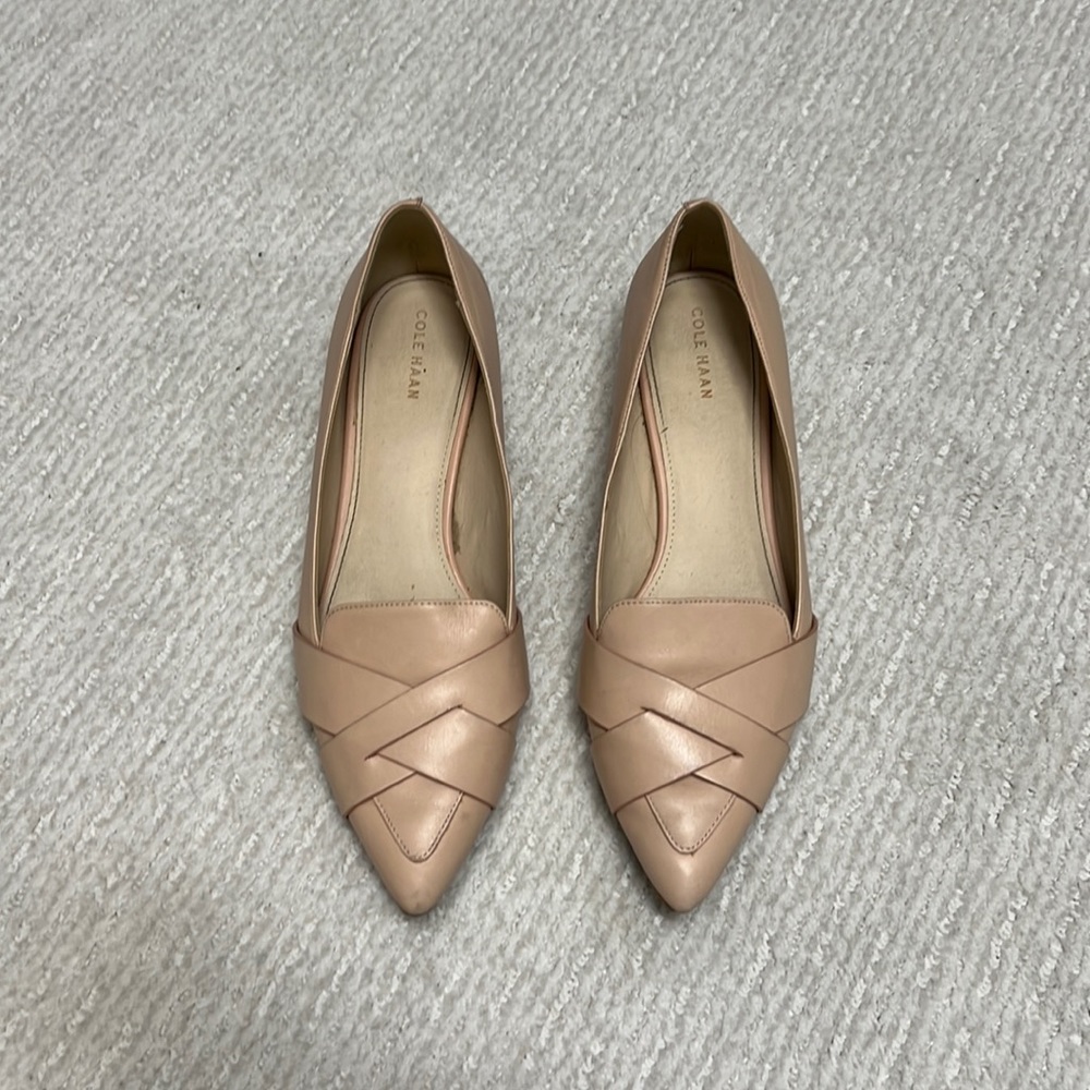 Nude/pale pink Cole Haan flats with 3/4 inch heel.
